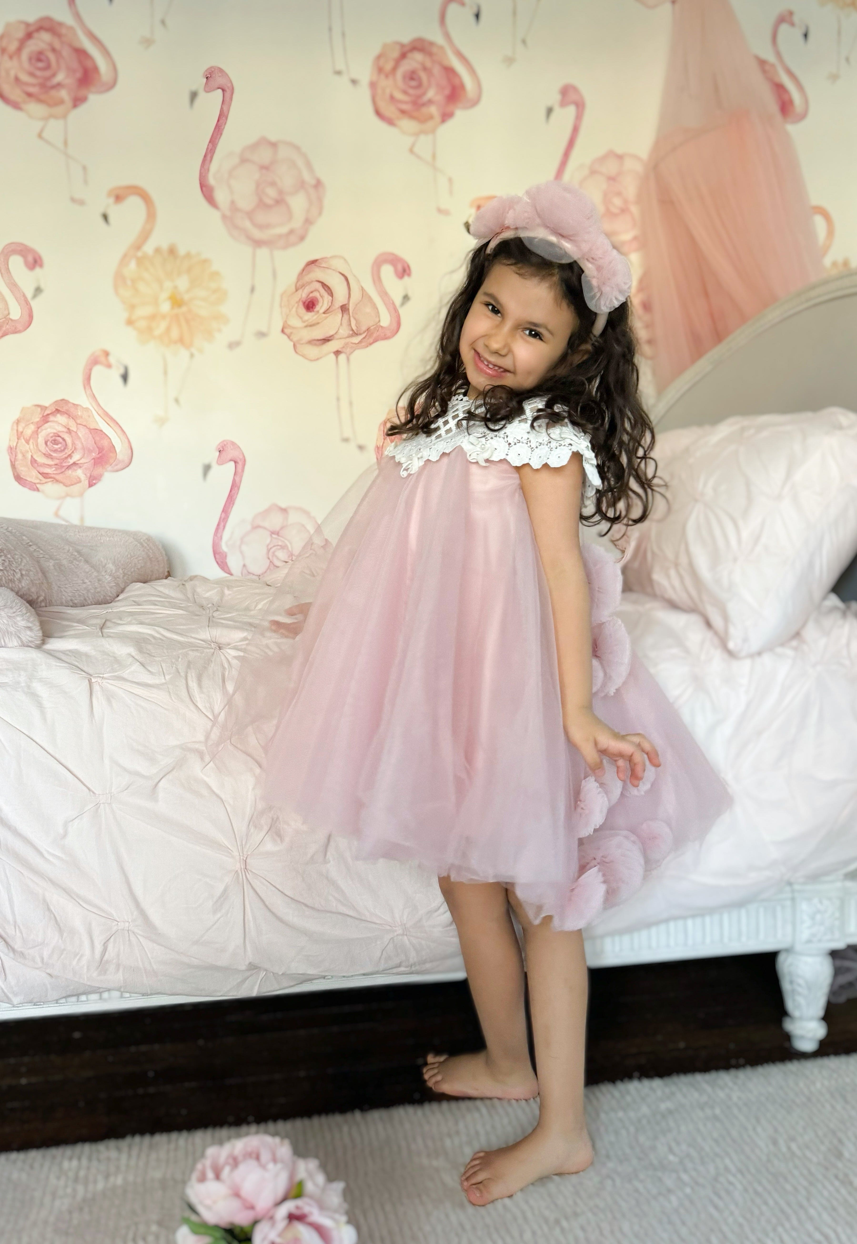 Child wearing Rosa pink tulle flower headband styled with a blush pink tulle dress, perfect for special occasions and formal outfits