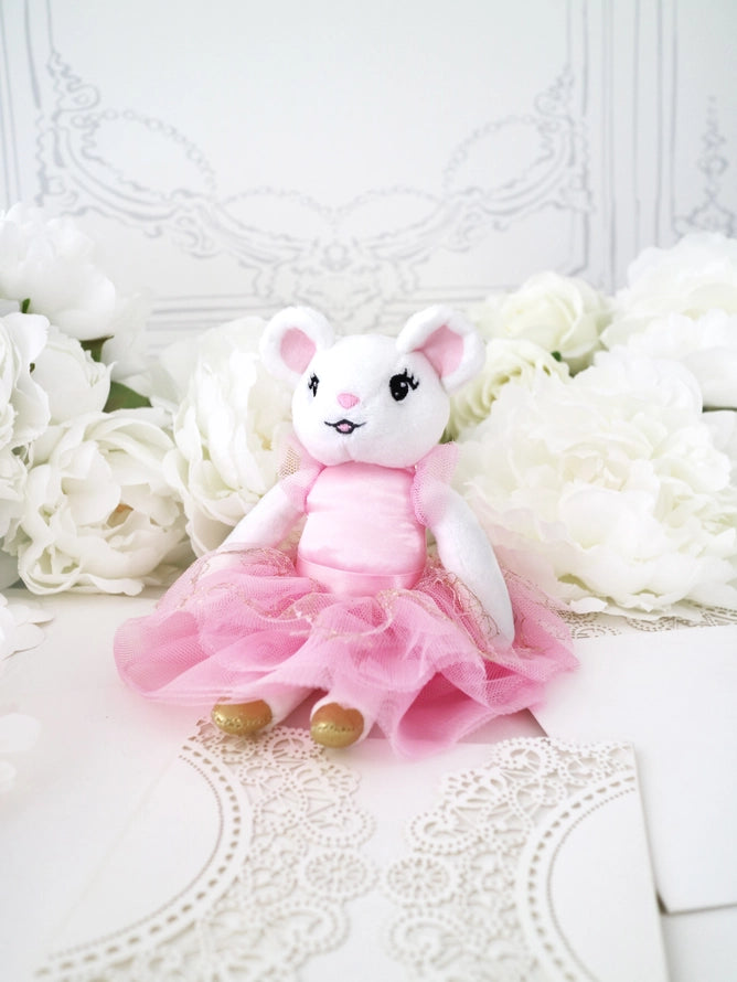 Small Claris mouse plush toy in pink dress, soft stuffed animal for kids