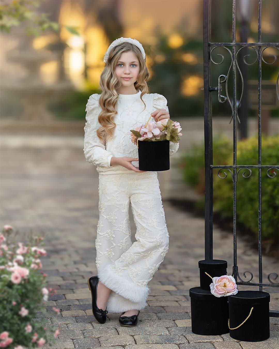 textured ivory pants with floral detail along with fur trim at the bottom. perfect to pair with any other piece from the Ava collection