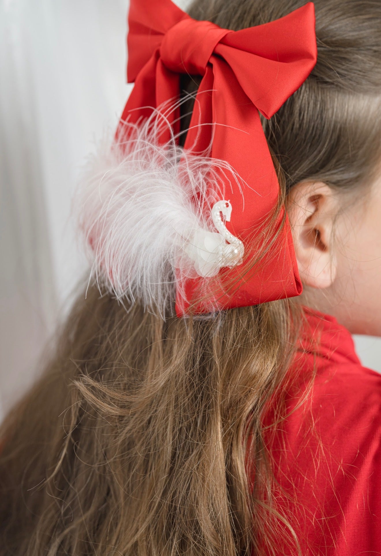 Anise Satin Embroidered Hair Bow in red statement bow with feather detail