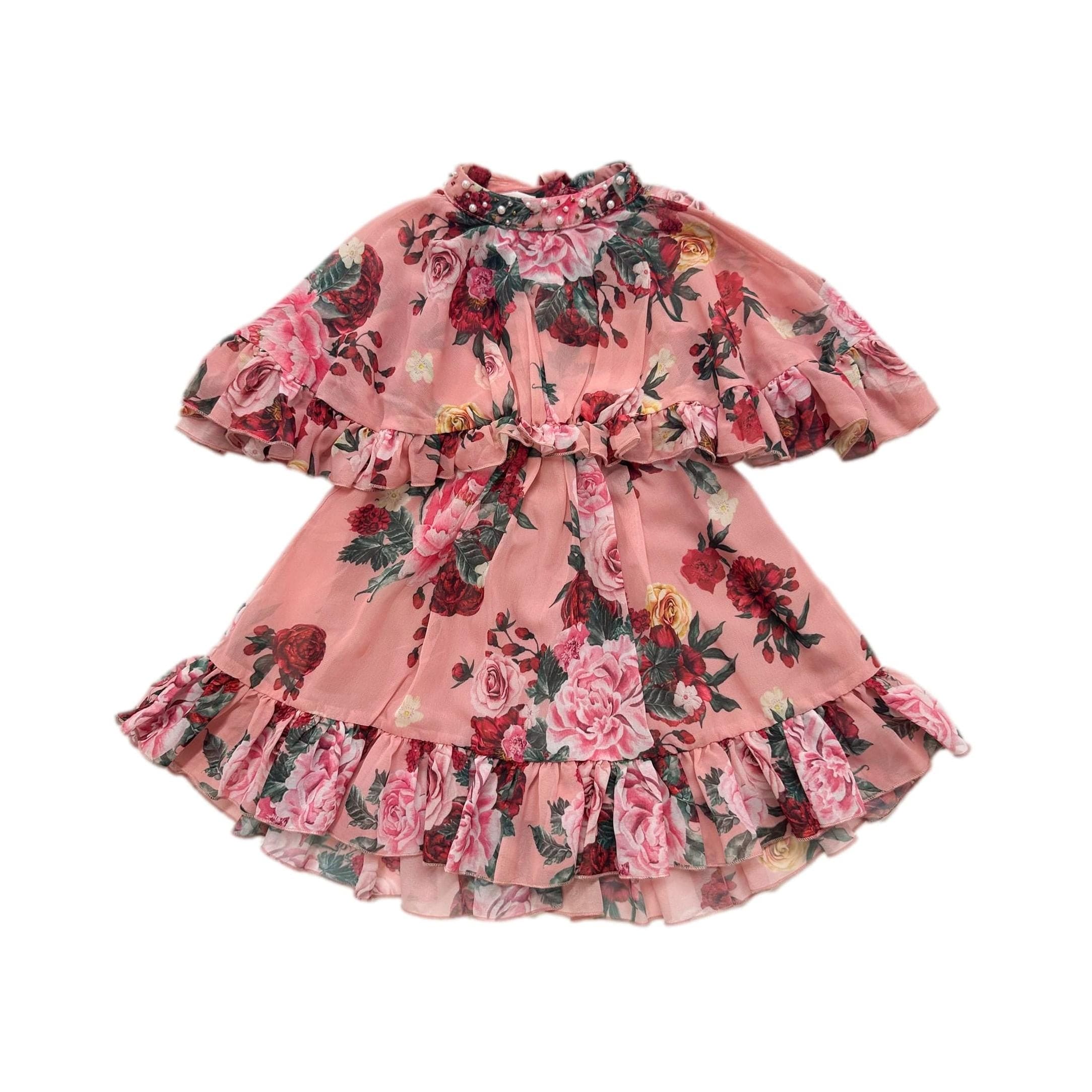 Flora pink floral girls dress with ruffle cape sleeves, pearl and jewel beaded neckline, high low skirt, and back zipper closure.