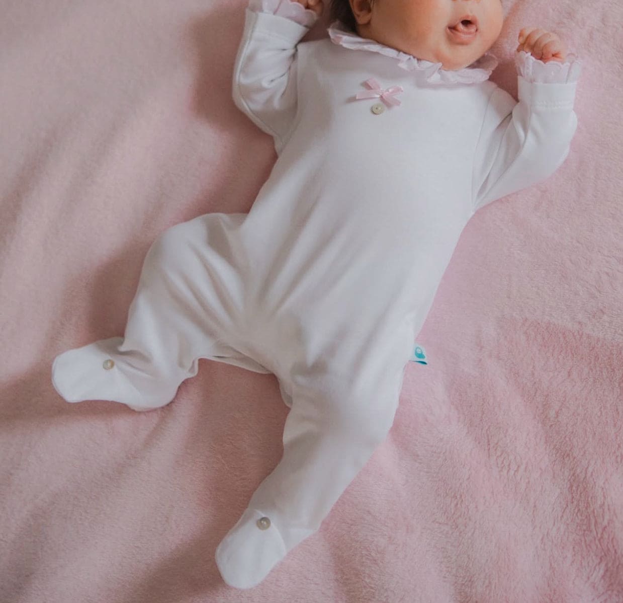 Baby White Cotton Babygrow with Pink Swiss Dot Ruffle Collar