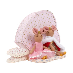 Two plush toys in dresses with a pink polka dot box on a white background