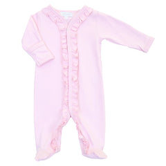 A light pink baby footed sleeper with long sleeves, ruffled trim along the front placket, and ruffled cuffs and ankles, shown on a plain white background.