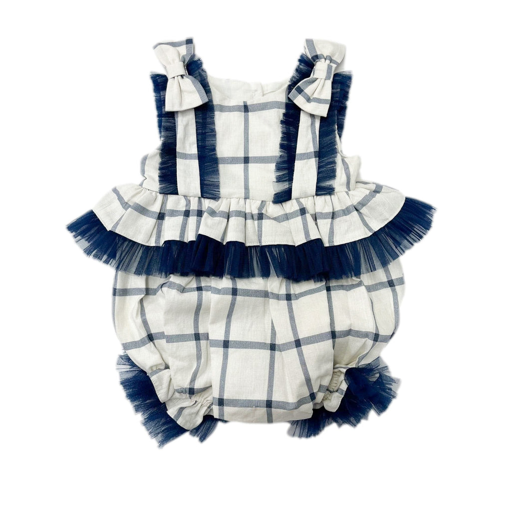 Checkered linen romper in ivory and navy with tulle ruffle trim and rhinestone buttons. Lightweight and perfect for special occasions.
