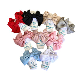 Lace ruffle socks with detachable satin bows and stretchy fit. Stylish accessory perfect for baby girls and special occasions.
