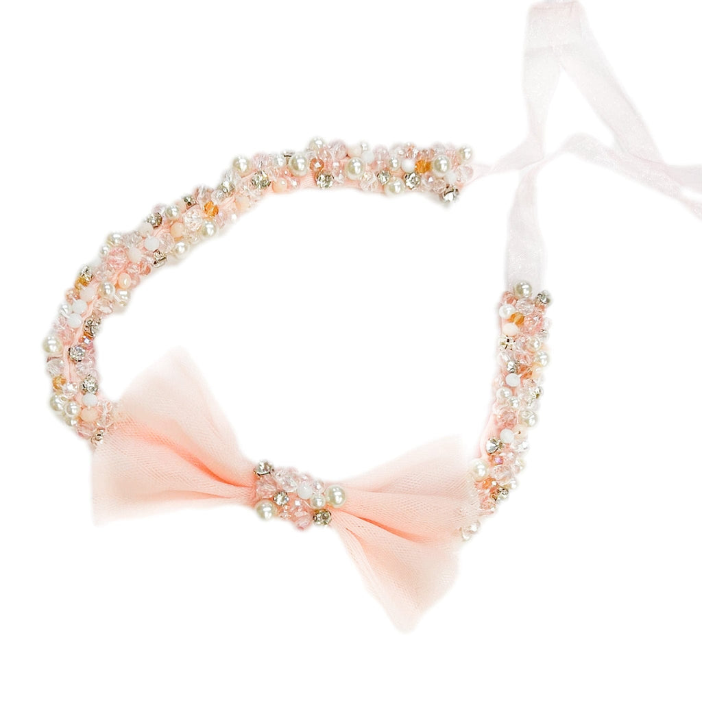 Handcrafted tulle hair sash with rhinestones, pearls, and organza ties, designed to match the Sugar Plum Collection for girls.